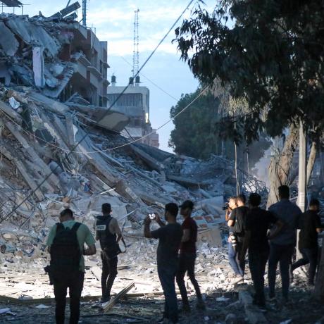 Journalists inspect the damage to Gaza City following bombing by the Israeli army.